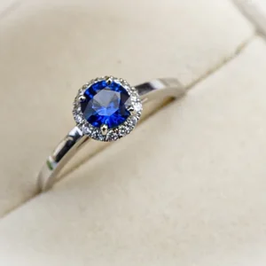 Blue Sapphire and Diamond Halo Engagement Ring